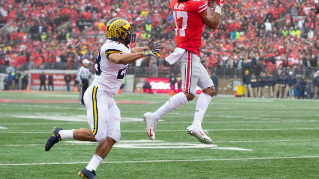 Chris Olave scores against Michigan